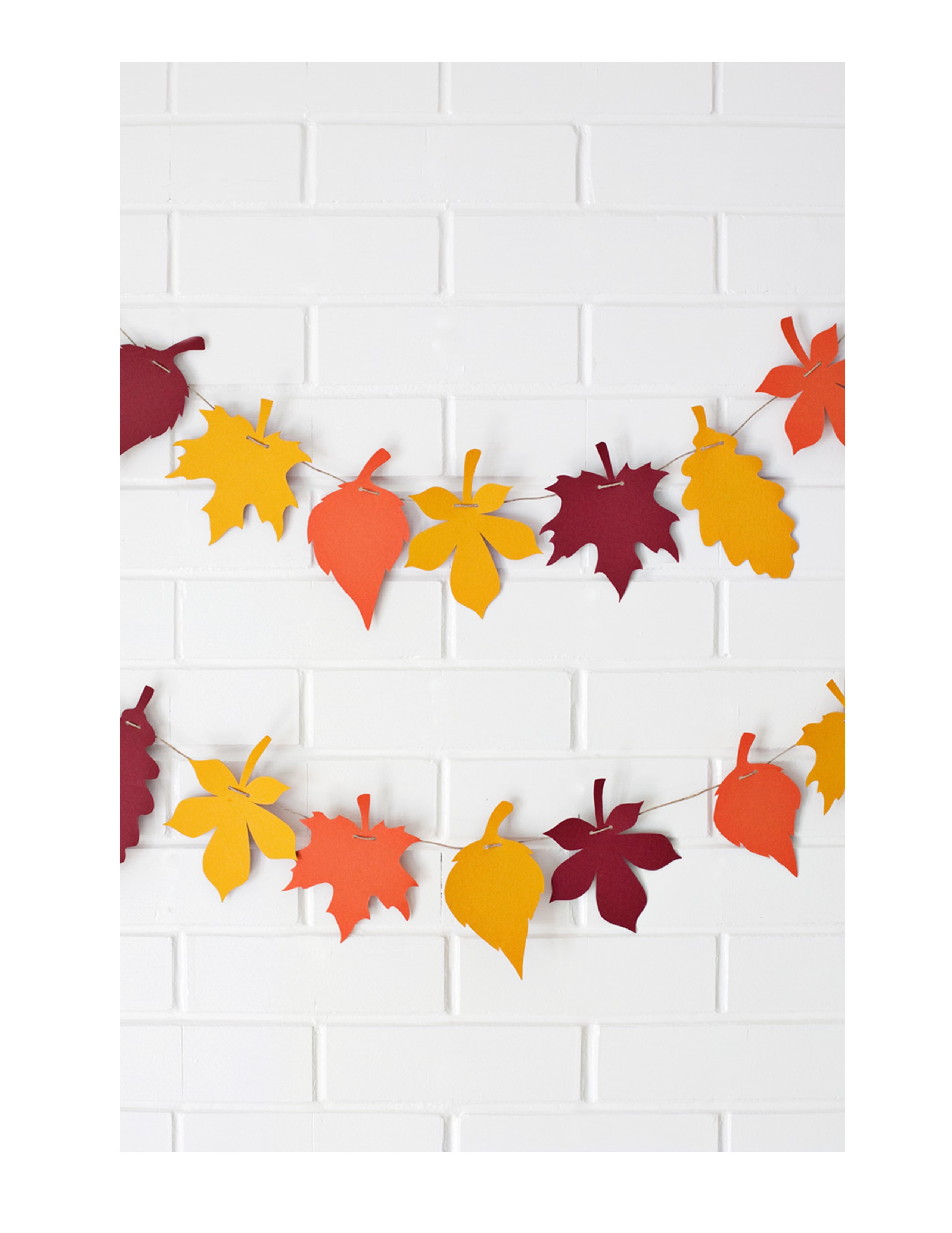 Fall paper leaves hung on a wall