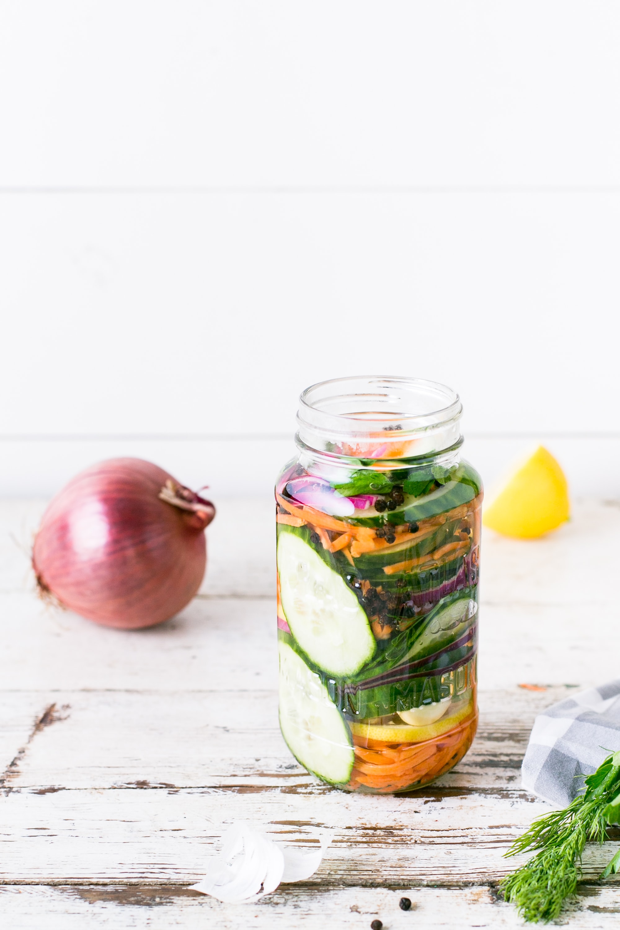 Glass jar with chopped vegetables inside