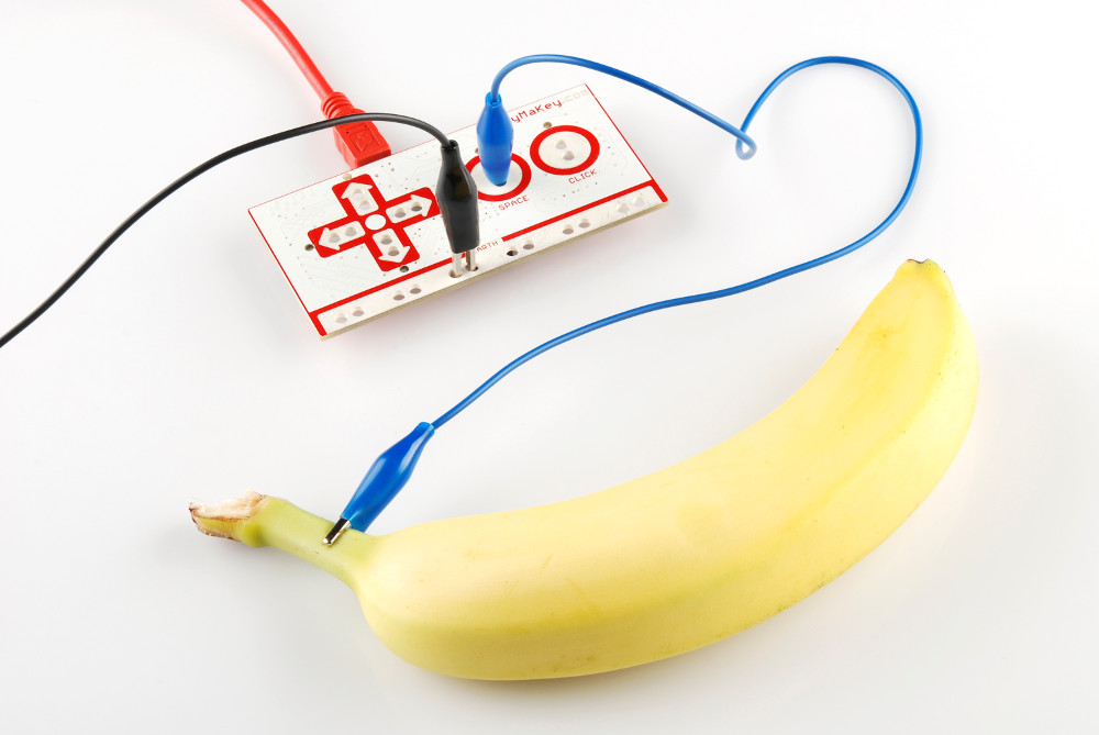 banana plugged into a makey makey circuit board