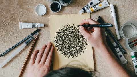 adult coloring a mandala