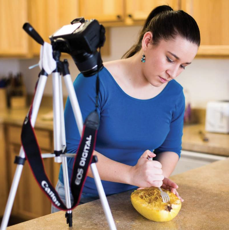 Mariah Gladstone cooking a squash