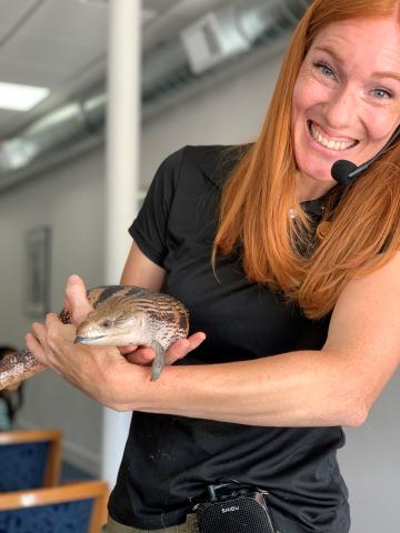 Animal Wonders presentor Jessi shows a reptile.